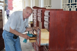 Bob was busy putting finishing touches on the cabinets in his last few days of work.  He built the cabinets at his home workshop in Wisconsin, then took them apart to ship down to Haiti and put them back together down here.  Fortunately all the parts were numbered and Audrey made sure they all went in the right place!