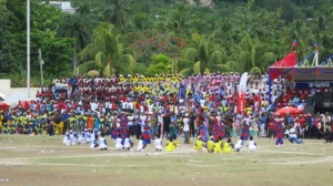 Haitian school students in colorful uniforms celebrating Flag Day in Jérémie on May 18th