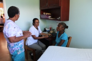 Sharon helping Cherlie with patient assessments