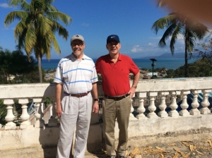 Dr. Greg VonRoenn and Dr. Dan Tanty stand outside the general hospital in Jérémie, looking out over the town